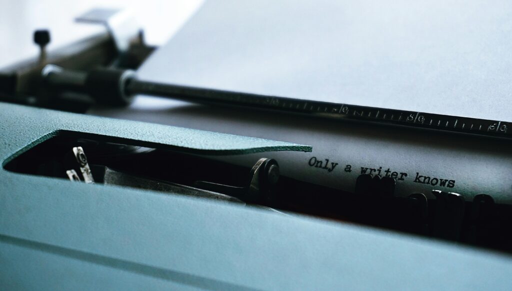 Close-up Photography of Typewriter With Only a Writer Knows Text on Printer Paper