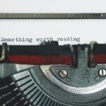 Black and Red Typewriter on White Table