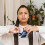 A Woman Holding a Torn Photo